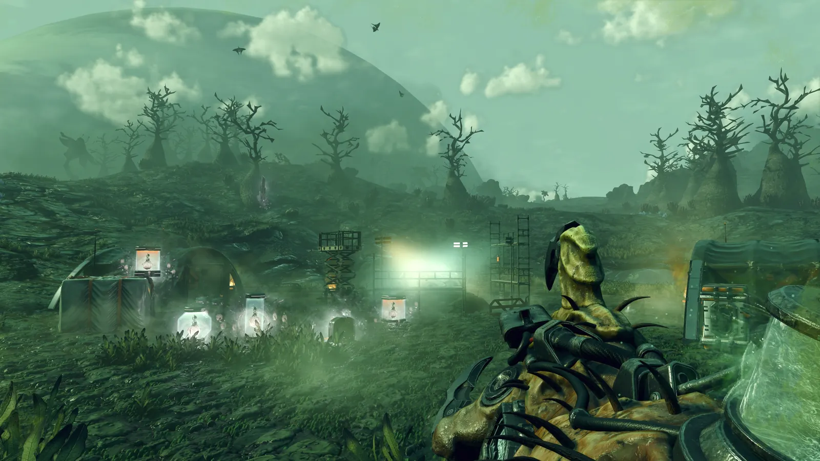 A traveller approaching a strange outpost on a misty planet