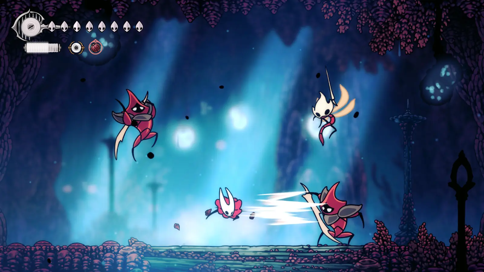 Hornet in combat in a blue-lit cavern. Developer-provided screenshot; not a GameOnCue capture.